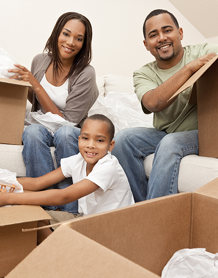 Family Packing Moving Boxes